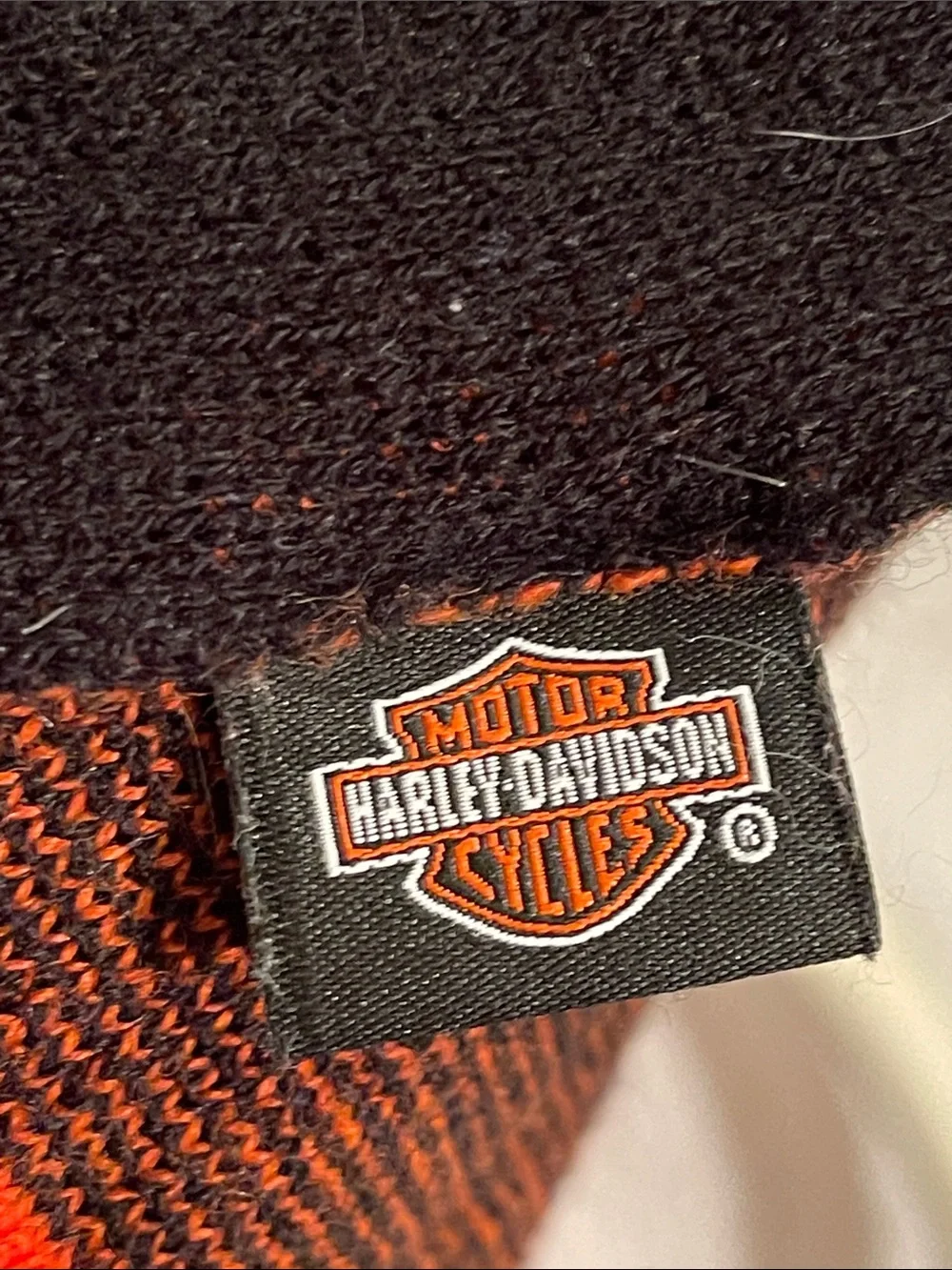 Black and orange knit scarf w/ Harley-Davidson white lettering and orange detail